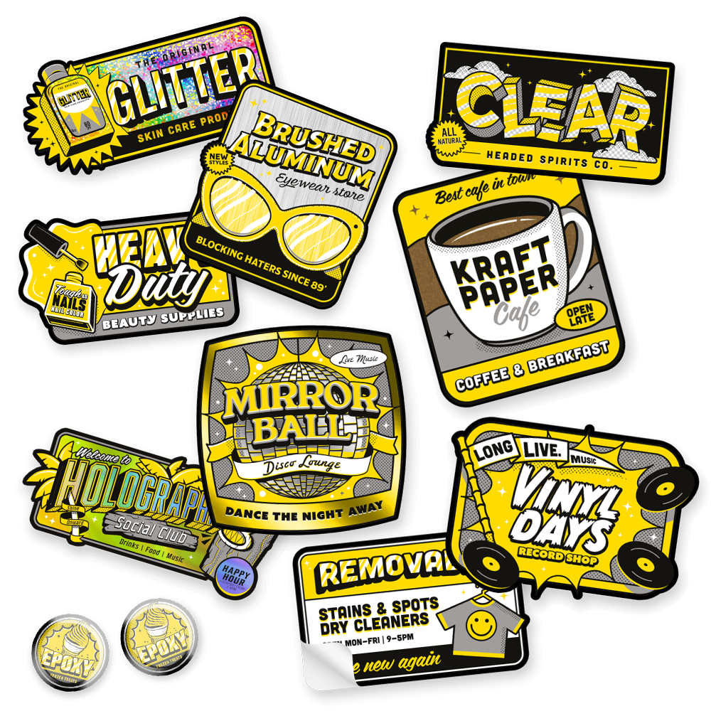 Verschiedene bunte Sticker in Gelb und Schwarz mit Texten wie "Glitter", "Clear", "Kraft Paper Cafe" und "Mirror Ball".