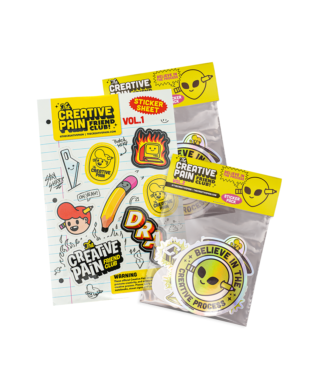 Stickerbogen "Creative Pain Friend Club" neben zwei Sticker-Packs mit gelben Headerkarten