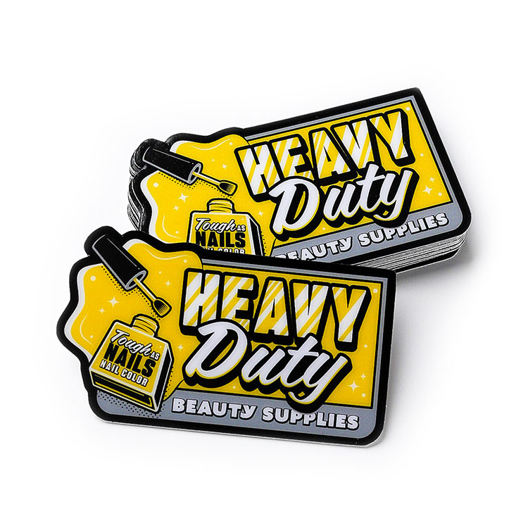 Zwei gelbe und schwarze Heavy Duty-Aufkleber.
